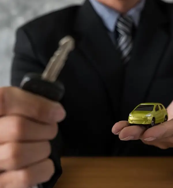 woman-sitting-red-car-receiving-keys
